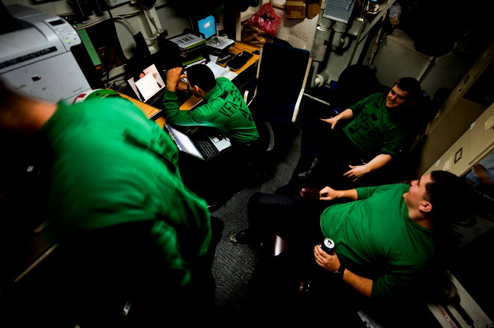 US Navy 110203-N-2055M-182 Sailors enjoy a break inside the squadron electrical shop aboard USS Carl Vinson (CVN 70)