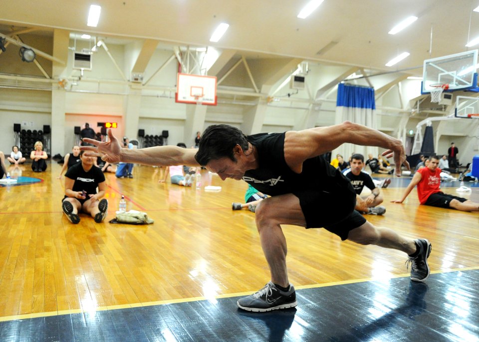 US Navy 110203-N-2858S-402 Tony Horton, creator of fitness program P90X, demonstrates a lunge for fans attending his demonstration at Naval Air Fac