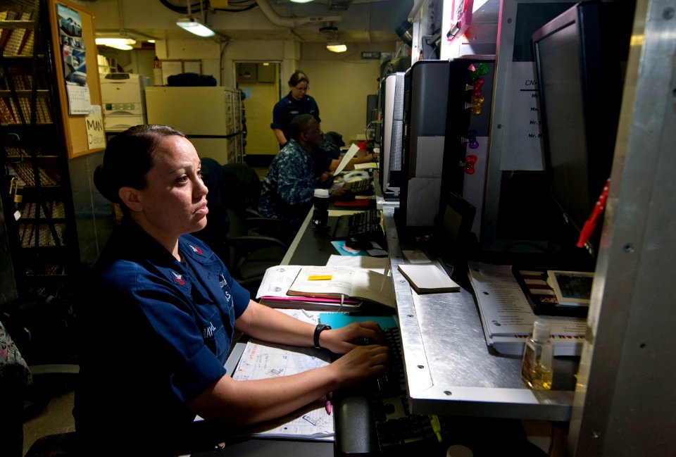 US Navy 110203-N-7488A-006 Logistics Specialist 1st Class Martha Mayoral enters information on the Organizational Management Maintenance System-Nex
