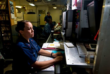 US Navy 110203-N-7488A-006 Logistics Specialist 1st Class Martha Mayoral enters information on the Organizational Management Maintenance System-Nex