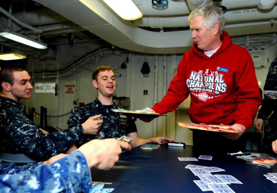 US Navy 110206-N-6632S-624 U.S. Rep. Mo Brooks (R-Ala.) passes out cookies donated by various schools to Sailors aboard the aircraft carrier USS Ge