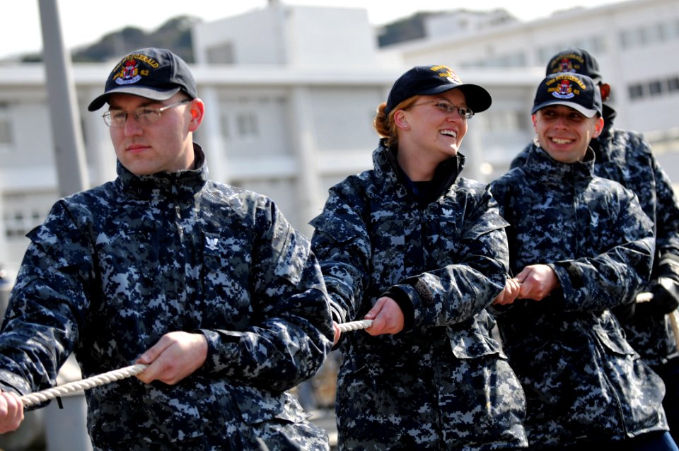 US Navy 110202-N-9818V-053 Sailors take in mooring lines as the guided-missile destroyer USS Fitzgerald (DDG 62) gets underway