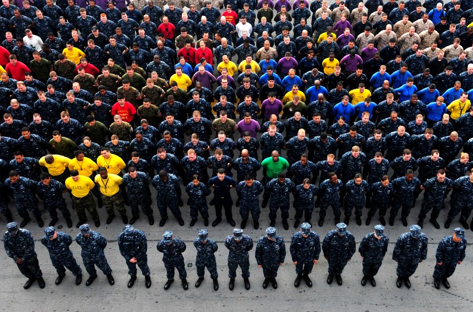 US Navy 110204-N-5538K-307 Sailors and Marines stand in formation during an award ceremony aboard USS Essex (LHD2)