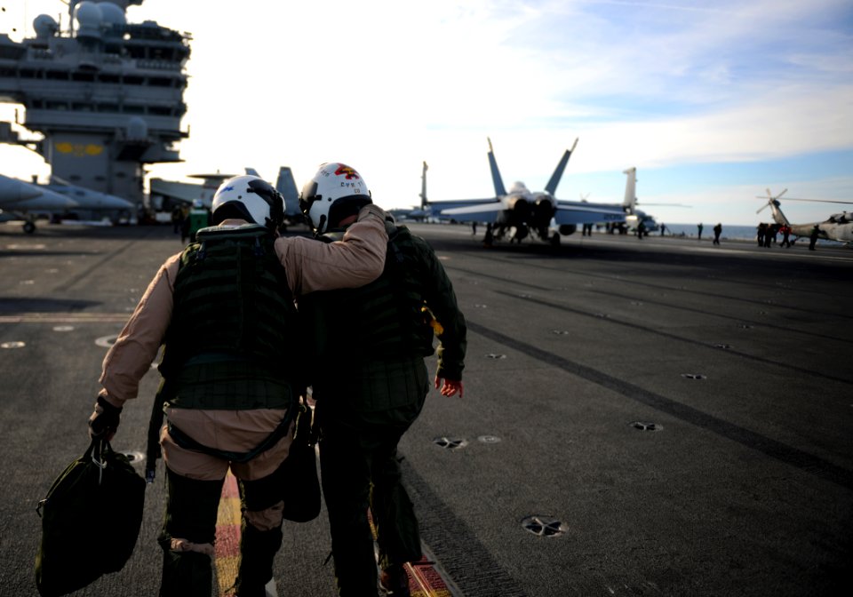 US Navy 110202-N-YZ751-303 Capt. Chip Miller, right, commanding officer of the aircraft carrier USS George H.W. Bush (CVN 77), and Capt. Jeffery A