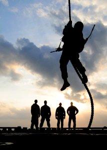 US Navy 110204-N-5538K-240 A Marine fast ropes onto the port aircraft elevator of USS Essex (LHD 2)