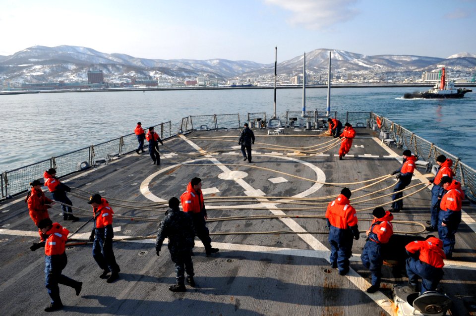 US Navy 110209-N-9818V-067 Sailors aboard the guided-missile destroyer USS Fitzgerald (DDG 62) secure mooring lines after departing Otaru, Japan
