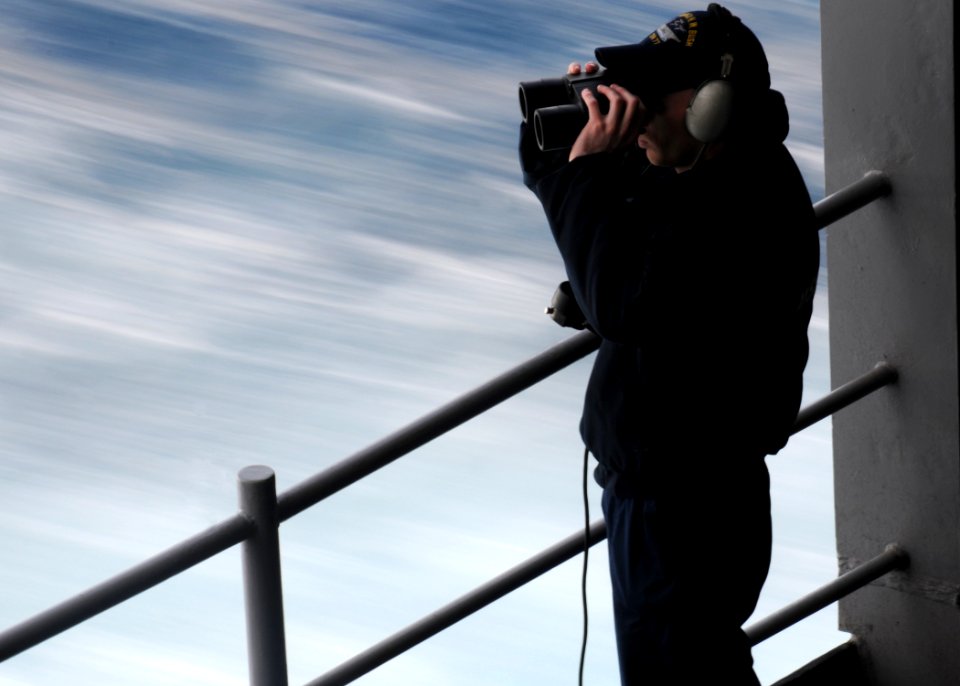US Navy 110208-N-7004H-055 eaman Apprentice Ryan Wetzel stands fantail lookout watch aboard the aircraft carrier USS George H.W. Bush (CVN 77)