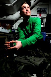 US Navy 110204-N-8040H-127 Aircrew Survival Equipmentman Airman Janine Davis performs a scheduled inspection on aviation life support systems aboar