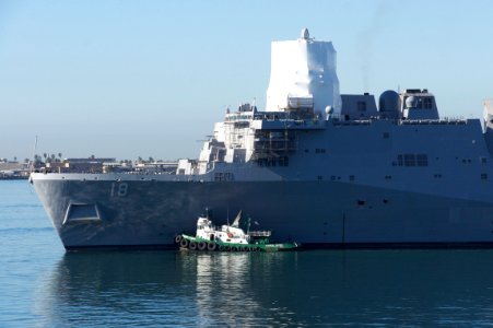 US Navy 110204-N-ZC343-543 USS New Orleans (LPD 18), assisted by tugboats, departs dry-dock to return to Naval Base San Diego
