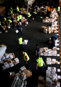 US Navy 110210-N-7488A-621 Sailors sort mail in the hangar bay aboard USS Carl Vinson (CVN 70)
