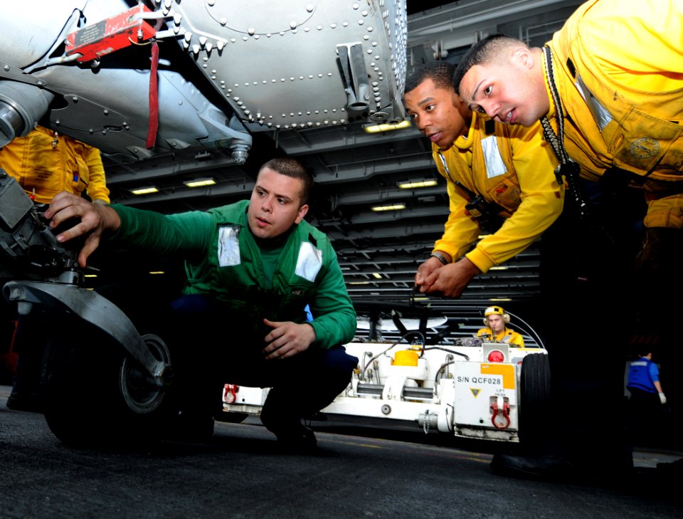 US Navy 110204-N-6632S-005 Aviation Machinist's Mate Airman Nicholas Castello, assigned to Helicopter Sea Combat Squadron (HSC) 9, shows Sailors fr