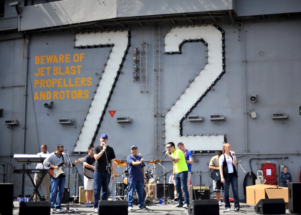 US Navy 110210-N-PM781-002 Sailors assigned to USS Abraham Lincoln (CVN 72) ship's band perform during a steel beach picnic aboard the ship