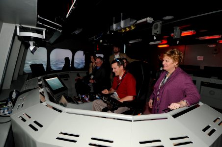 US Navy 110209-N-IK959-013 Attendees of the 2011 Training Magazine Conference and Expo take turns on a littoral combat ship (LCS) simulator at the