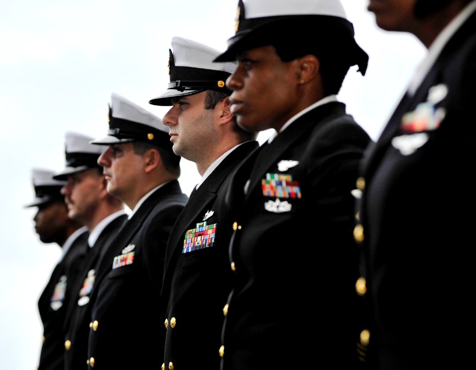 US Navy 110206-N-6003P-086 Chief petty officers stand in ranks during a burial at sea for Navy veteran Duane Howard McFarland aboard the aircraft c