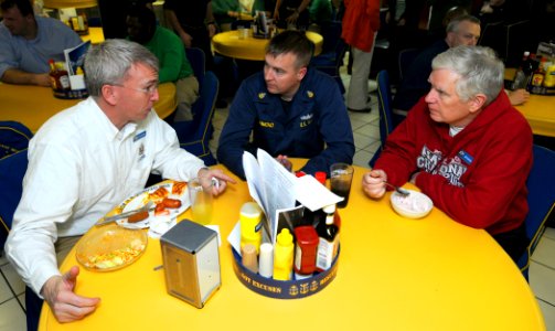 US Navy 110206-N-6632S-579 Operations Specialist Senior Chief Brett Richmond peaks with U.S. Reps. Todd Platts, left, and Mo Brooks
