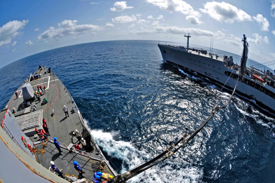 US Navy 110211-N-9811S-068 Sailors aboard the Arleigh Burke-class guided-missile destroyer USS Barry (DDG 52) take part in a fueling at sea with th