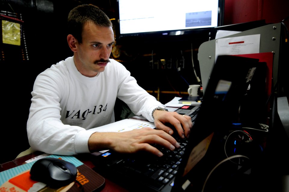 US Navy 110204-N-8040H-191 Lt. Luke Brown tands squadron duty officer watch in the squadron's ready room aboard USS Carl Vinson (CVN 70)