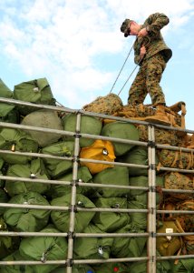 US Navy 110208-N-5538K-073 A Marine ties down sea bags during exercise Cobra Gold 2011 photo