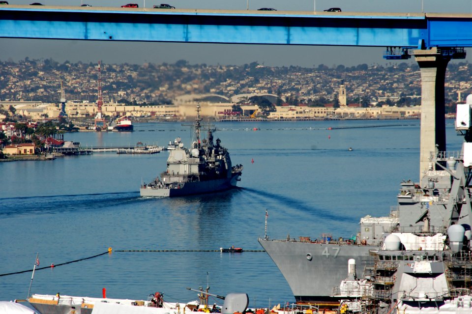 US Navy 110204-N-ZC343-520 USS Mobile Bay (CG 53) passes under the Coronado Bridge as it departs Naval Base San Diego