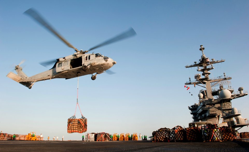US Navy 110210-N-7981E-575 An MH-60S Sea Hawk helicopter delivers cargo aboard USS Carl Vinson (CVN 70)
