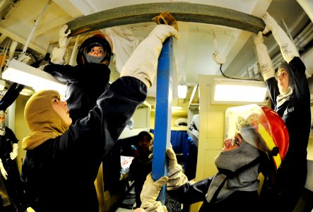 US Navy 110205-N-6003P-453 Sailors practice shoring techniques during a general quarters drill aboard the aircraft carrier USS Harry S. Truman (CVN