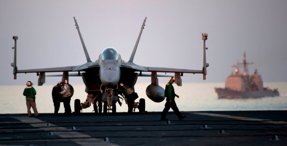 US Navy 110208-N-7981E-168 Sailors assigned to Strike Fighter Squadron (VFA) 81 prepare an F-A-18E Super Hornet for a mission aboard the Nimitz-cla