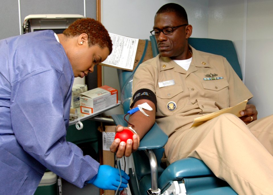 US Navy 110207-N-PS473-008 Senior Chief Culinary Specialist Edward Sivells gives blood during the Armed Services Blood Program blood drive at Comma