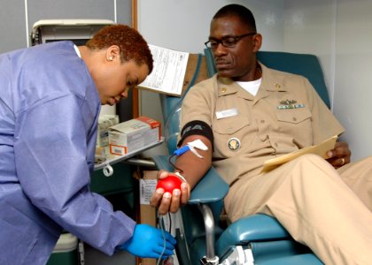 US Navy 110207-N-PS473-008 Senior Chief Culinary Specialist Edward Sivells gives blood during the Armed Services Blood Program blood drive at Comma