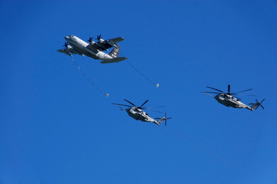 US Navy 110212-N-ZC343-015 Aircraft simulate refueling operations as they fly over San Diego Bay and the Coronado Bridge during the Centennial of N