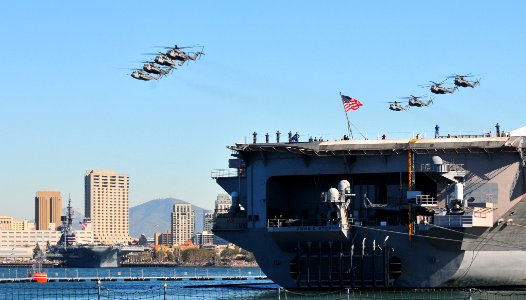US Navy 110212-N-ZS026-113 Formations of CH-53 Sea Stallion helicopters fly over San Diego Bay near USS John C. Stennis (CVN 74) during the Parade