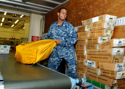 US Navy 110209-N-IO627-032 Logistics Specialist 3rd Class Jonathan Sanders loads mail into a truck at the Fleet and Industrial Supply Center (FISC)