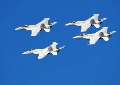US Navy 110212-N-ZS026-390 A formation of F-A-18 Hornet strike fighters fly over San Diego Bay during the Centennial of Naval Aviation Open House a