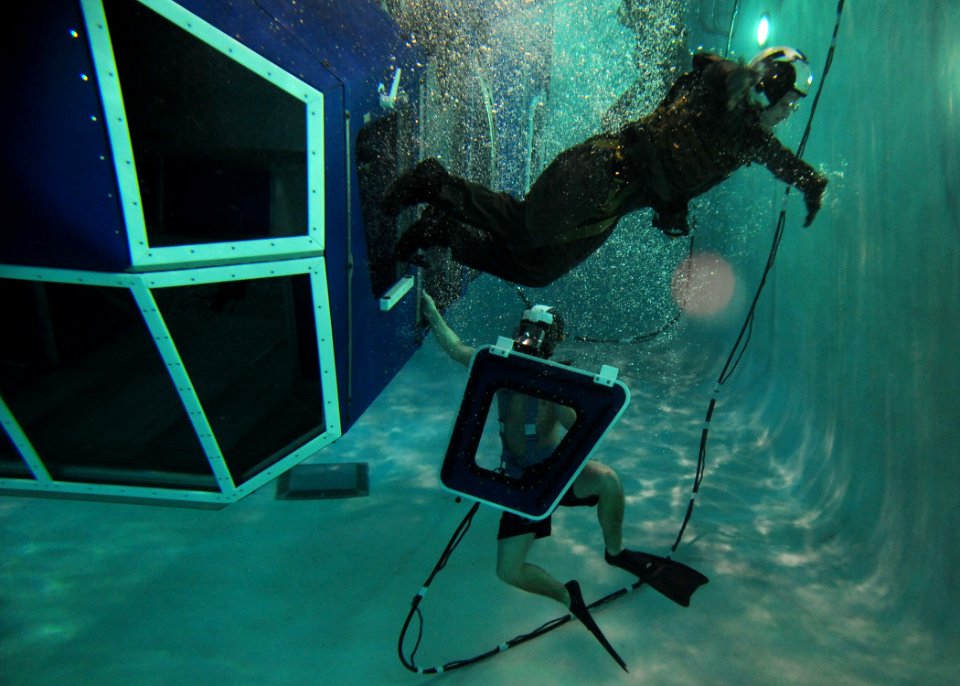 US Navy 110210-N-1810F-148 A naval aviator swims to the surface after exiting the 9D6 dunker during a training exercise at the Aviation Survival Tr