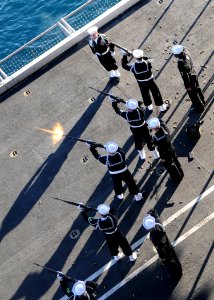 US Navy 110214-N-4590G-387 Members of the honor guard aboard the aircraft carrier USS Ronald Reagan (CVN 76) fire a rifle volley during a burial at