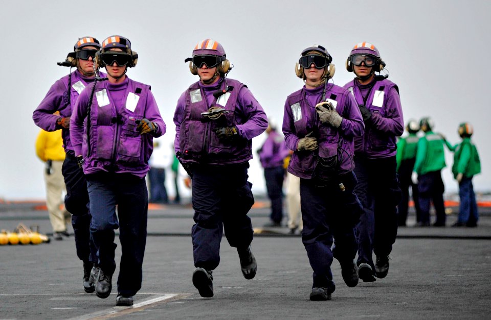 US Navy 110211-N-6003P-061 Sailors rush to aid other Sailors during a mass casualty drill aboard USS Harry S. Truman (CVN 75)