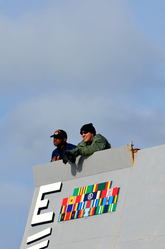 US Navy 110209-N-9818V-148 Cmdr. Dennis Velez, commanding officer of the guided-missile destroyer USS Fitzgerald (DDG 62), and Quartermaster Seaman