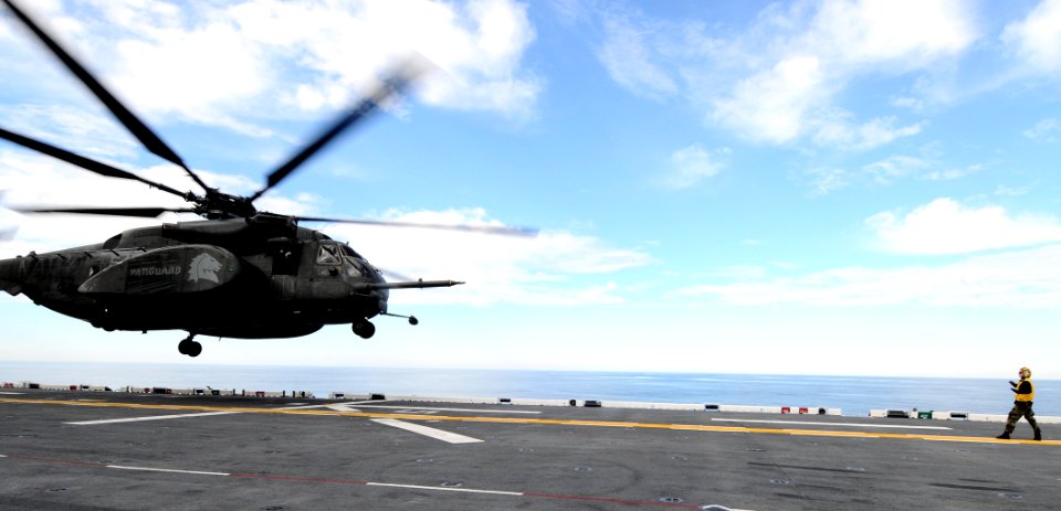 US Navy 110211-N-7508R-004 An MH-53E Sea Dragon helicopter assigned to Mine Countermeasures Squadron (HM) 14 lands aboard the multi-purpose amphibi