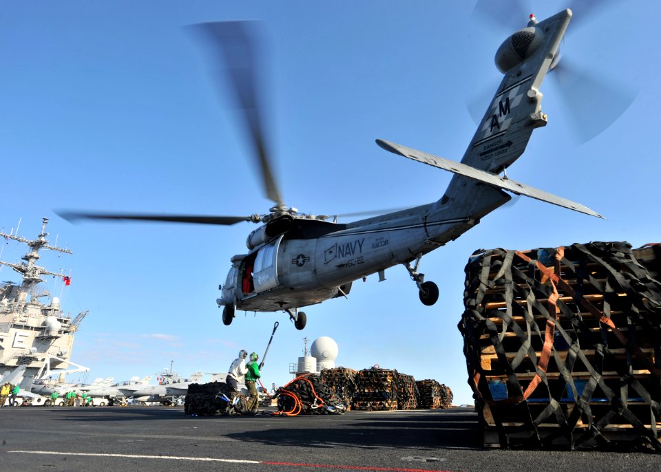US Navy 110213-N-0569K-142 An MH-60S Sea Hawk helicopter assigned to the Sea Knights of Helicopter Logistics Support Squadron (HSC) 22, transports