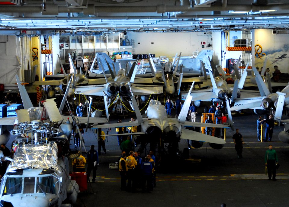 US Navy 110211-N-6908J-024 Aircraft and maintenance equipment assigned to Carrier Air Wing (CVW) 14 are in the hangar bay aboard USS Ronald Reagan