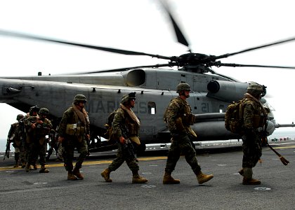 US Navy 110213-N-8607R-075 Marines assigned to the 31st Marine Expeditionary Unit (31st MEU) debark from a CH-53E Sea Stallion helicopter aboard th