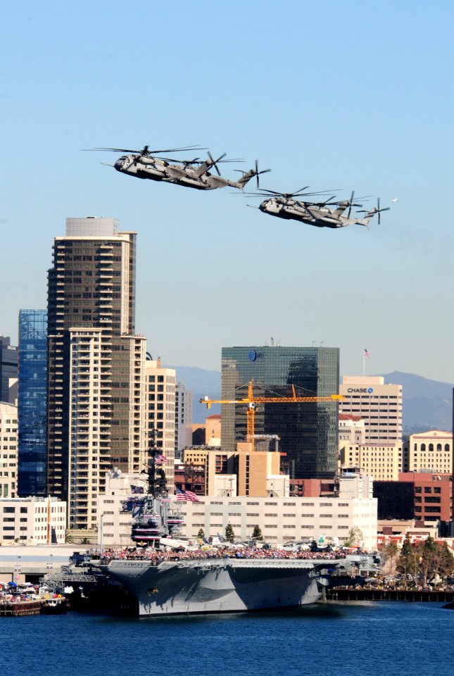 US Navy 110212-N-3659B-626 A formation of CH-53 Super Stallion helicopters flies past the USS Midway aircraft carrier museum during the Centennial