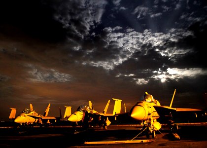 US Navy 110215-N-5082P-003 The aircraft carrier USS Enterprise (CVN 65) transits the Suez Canal before sunrise. Enterprise and Carrier Air Wing (CV