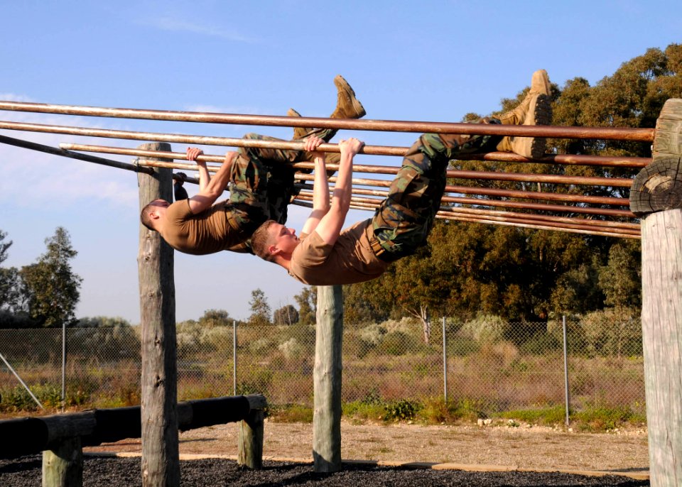 US Navy 110211-N-AW868-029 Seabees assigned to Alfa Company of Naval Mobile Construction (NMCB) 74 attempt the Marine Corps obstacle course at Nava