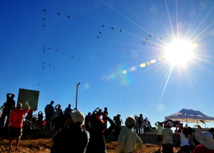 US Navy 110212-N-ZS026-405 Spectators watch as the Parade of Flight ends with a formation of 35 aircraft above Naval Air Station North Island