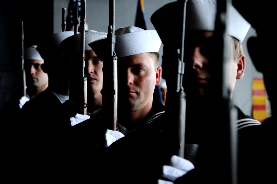 US Navy 110216-N-7508R-118 Members of the honor guard aboard the multipurpose amphibious assault ship USS Bataan (LHD 5) prepare to fire a rifle vo