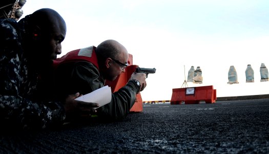 US Navy 110216-N-7508R-126 Lt. Cmdr. David Lewis, the meteorological officer aboard the multipurpose amphibious assault ship USS Bataan (LHD 5), pa