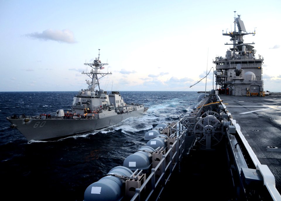 US Navy 110212-N-7508R-039 The guided-missile destroyer USS Roosevelt (DDG 80) prepares to receive a fuel hose from the multi-purpose amphibious as