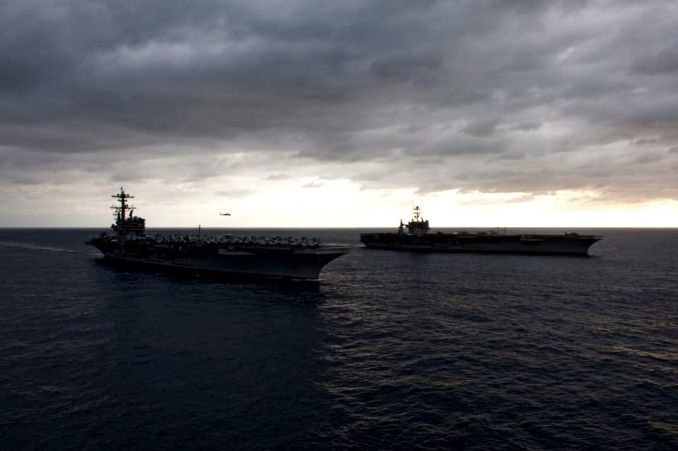 US Navy 110217-N-7317W-005 The aircraft carriers USS George H.W. Bush (CVN 77), front, and USS Harry S. Truman (CVN 75) conduct an ordnance transfe