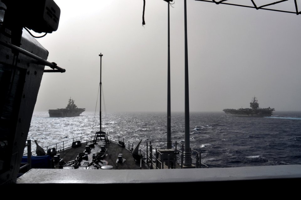 US Navy 110216-N-7293M-271 The amphibious assault ship USS Kearsarge (LHD 3), left, and the aircraft carrier USS Enterprise (CVN 65), are underway
