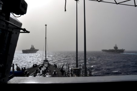 US Navy 110216-N-7293M-271 The amphibious assault ship USS Kearsarge (LHD 3), left, and the aircraft carrier USS Enterprise (CVN 65), are underway
